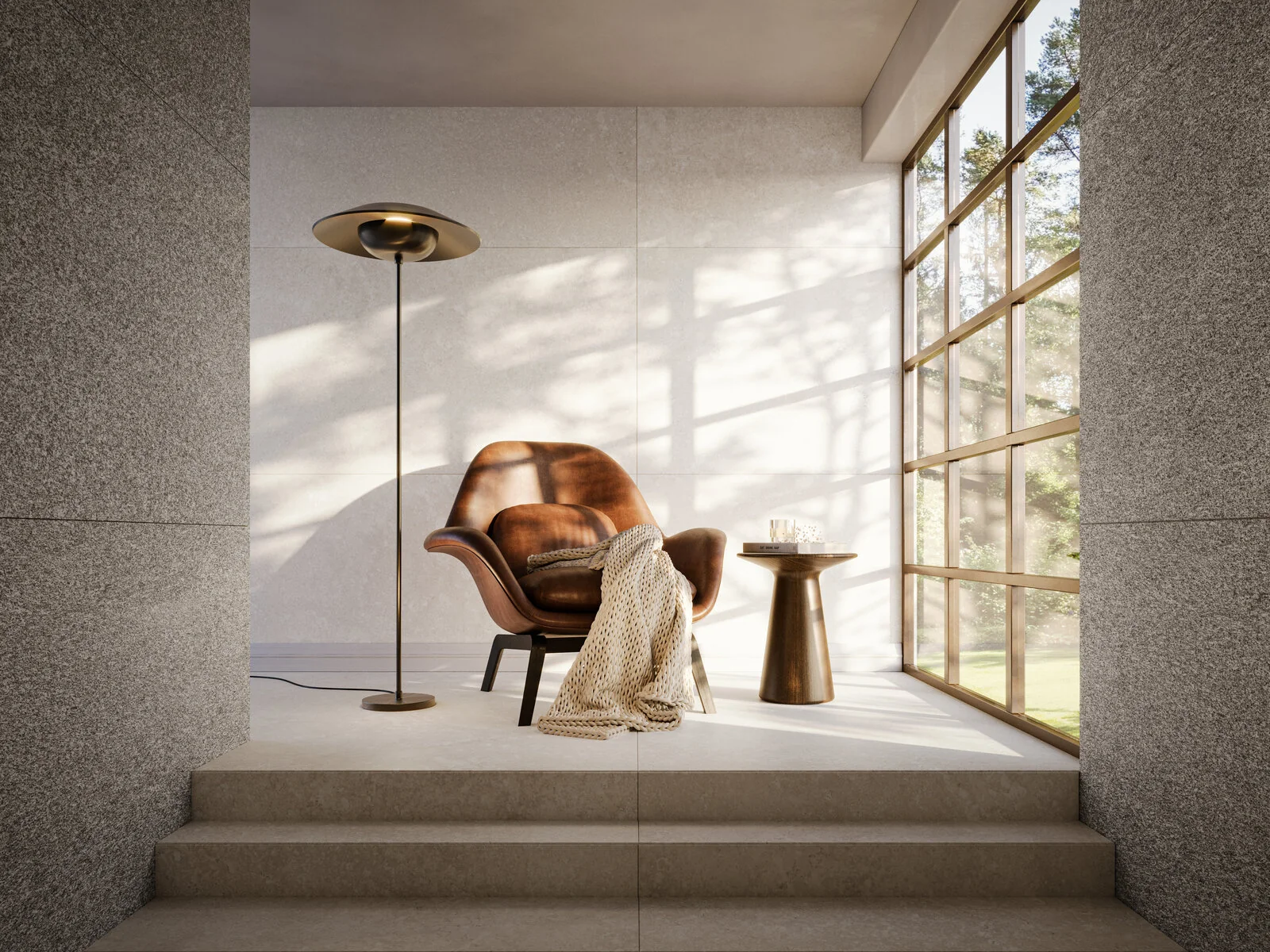 Sillón de piel con manta tejida y lámpara de pie sobre piso y muro de porcelanato